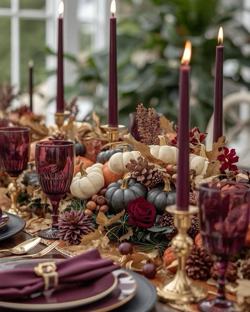 18 Autumn Dining Room Decor Ideas for a Warm and Inviting Space 16 Autumn table setting with brass candle holders, purple glassware, and mini pumpkins.
