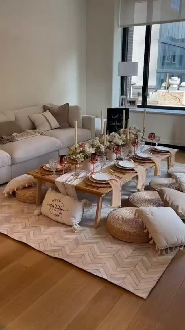 12 Bohemian Chic Dining Room Ideas for Effortless Style 9 Low wooden dining table with woven poufs and cream floor cushions on a rug.