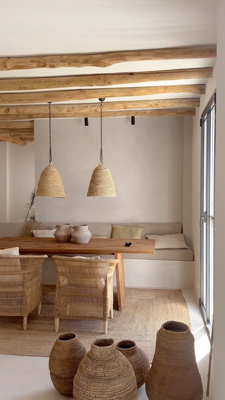 12 Bohemian Chic Dining Room Ideas for Effortless Style 3 Dining room with wooden beams, rattan chairs, woven pendant lights, and natural jute rug.