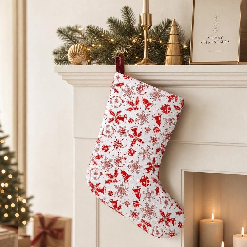 17 Christmas Decor Ideas with White for a Serene Home 10 White Christmas stocking with red patterns hanging from a decorated white fireplace mantle.