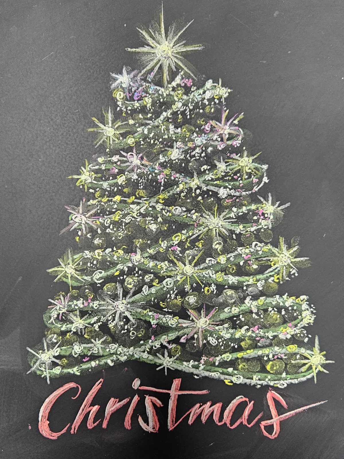 16 Christmas Decorations for Office Spaces That Shine 8 Chalk drawing of a decorated Christmas tree with a star on a blackboard.