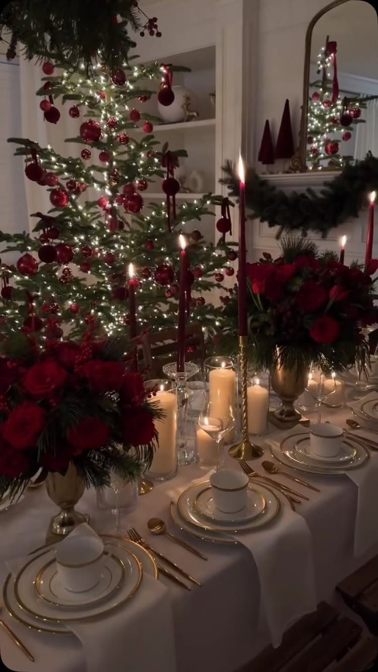 23 Christmas House Decorations Ideas for a Festive Home 17 Festive holiday tablescape with red roses, gold dinnerware, and candles near a Christmas tree.