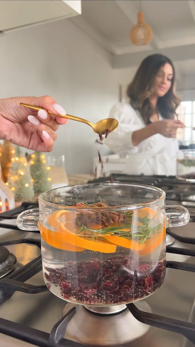 23 Christmas House Decorations Ideas for a Festive Home 16 Stovetop pot simmer with orange slices, cranberries, and rosemary for holiday scents.
