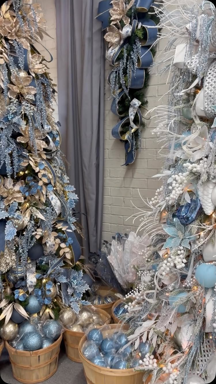 33 Christmas Party Decor Ideas to Bring the Holiday Magic 18 Blue and silver Christmas ornaments and frosted trees in a decorated room.