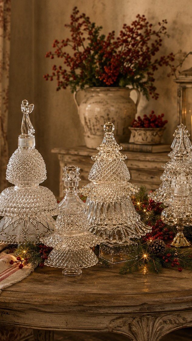33 Christmas Party Decor Ideas to Bring the Holiday Magic 21 Clear textured glass Christmas trees of different sizes on a rustic wooden table.