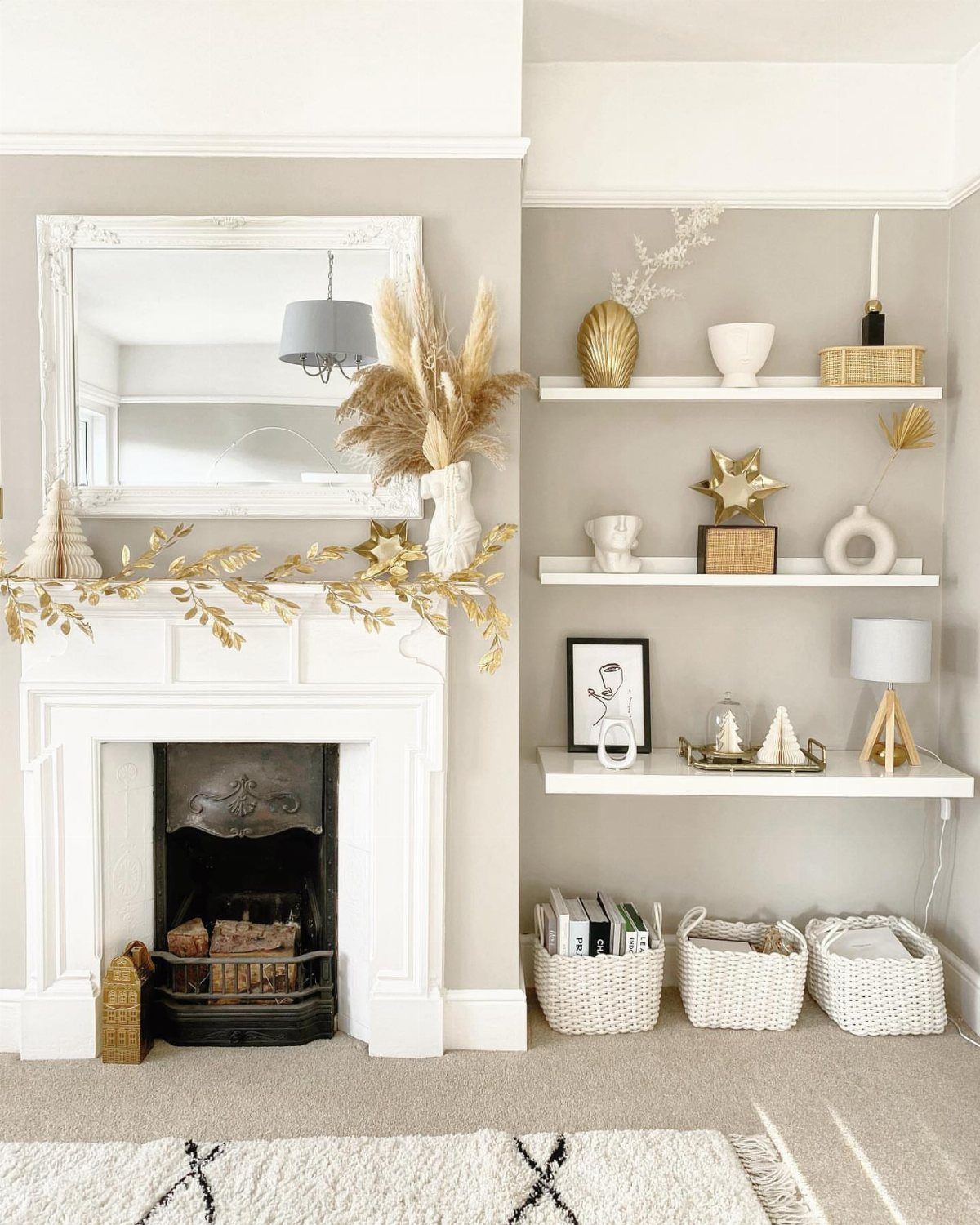 33 Christmas Party Decor Ideas to Bring the Holiday Magic 8 Gold leaf garland draped across a white fireplace mantel in a bright room.