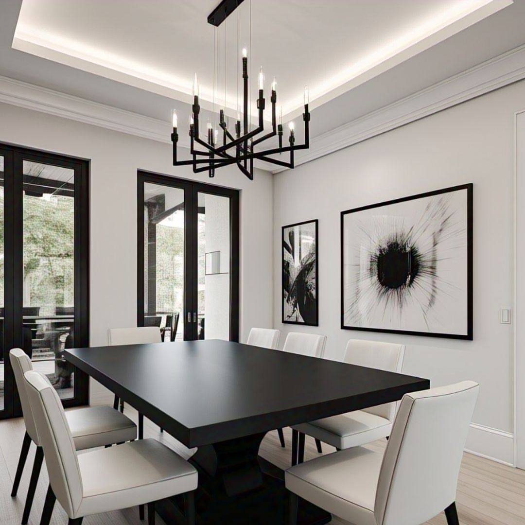 13 Contemporary Dining Room Decor Ideas for 2026 1 Black dining table and white chairs in a monochrome room with abstract art.
