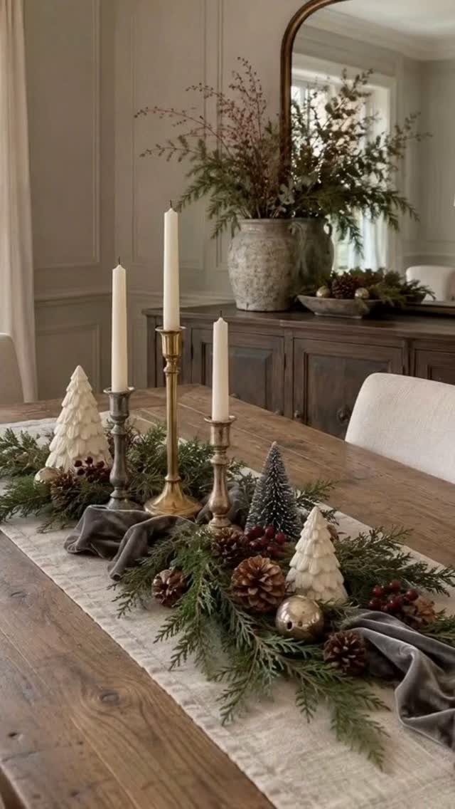 12 Cozy Christmas Living Room Ideas with Photos 3 Wooden table with fabric runner, evergreen garlands, and metal candle holders for Christmas.