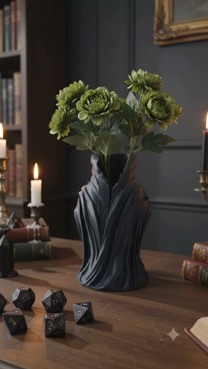 11 Dark Academia Dining Room Ideas for Moody Elegance 2 Green flowers in a dark textured vase on a wooden table with dice.