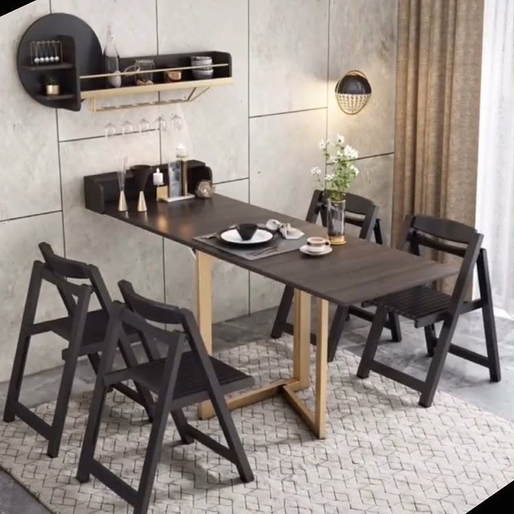 15 Dining Ideas for Small Spaces That Maximize Every Inch 12 Dark wood dining table with black folding chairs on a patterned grey rug.