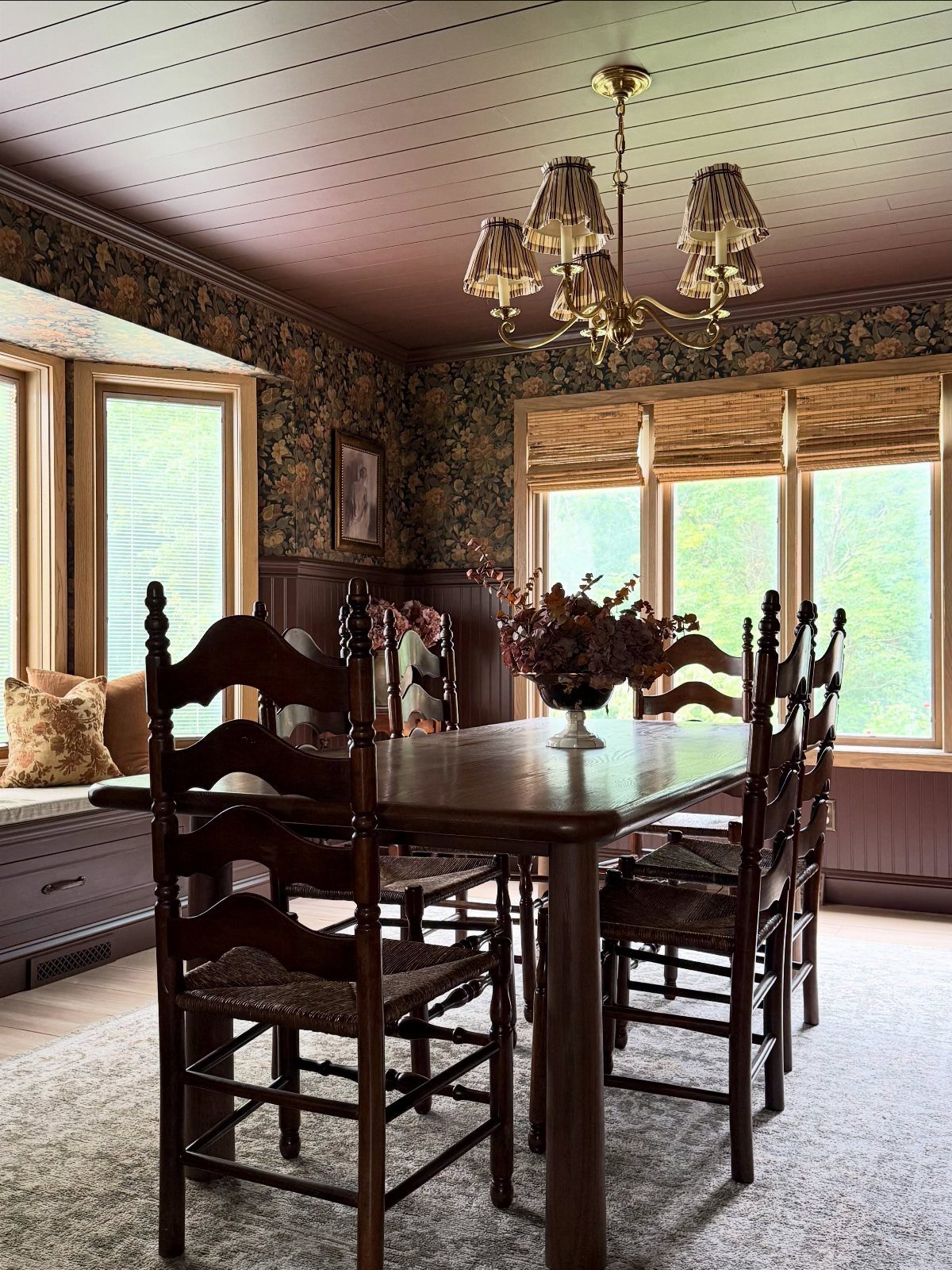 6 Dining Room Chair Rail Ideas for a Polished Look 1 Dining room with dark wood wainscoting, chair rail, and floral wallpaper.