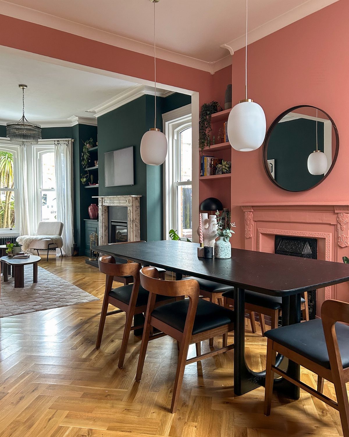 9 Dining Room Color Ideas for a Welcoming Space 7 Dining room with terracotta and teal color blocking walls and a dark wood table.