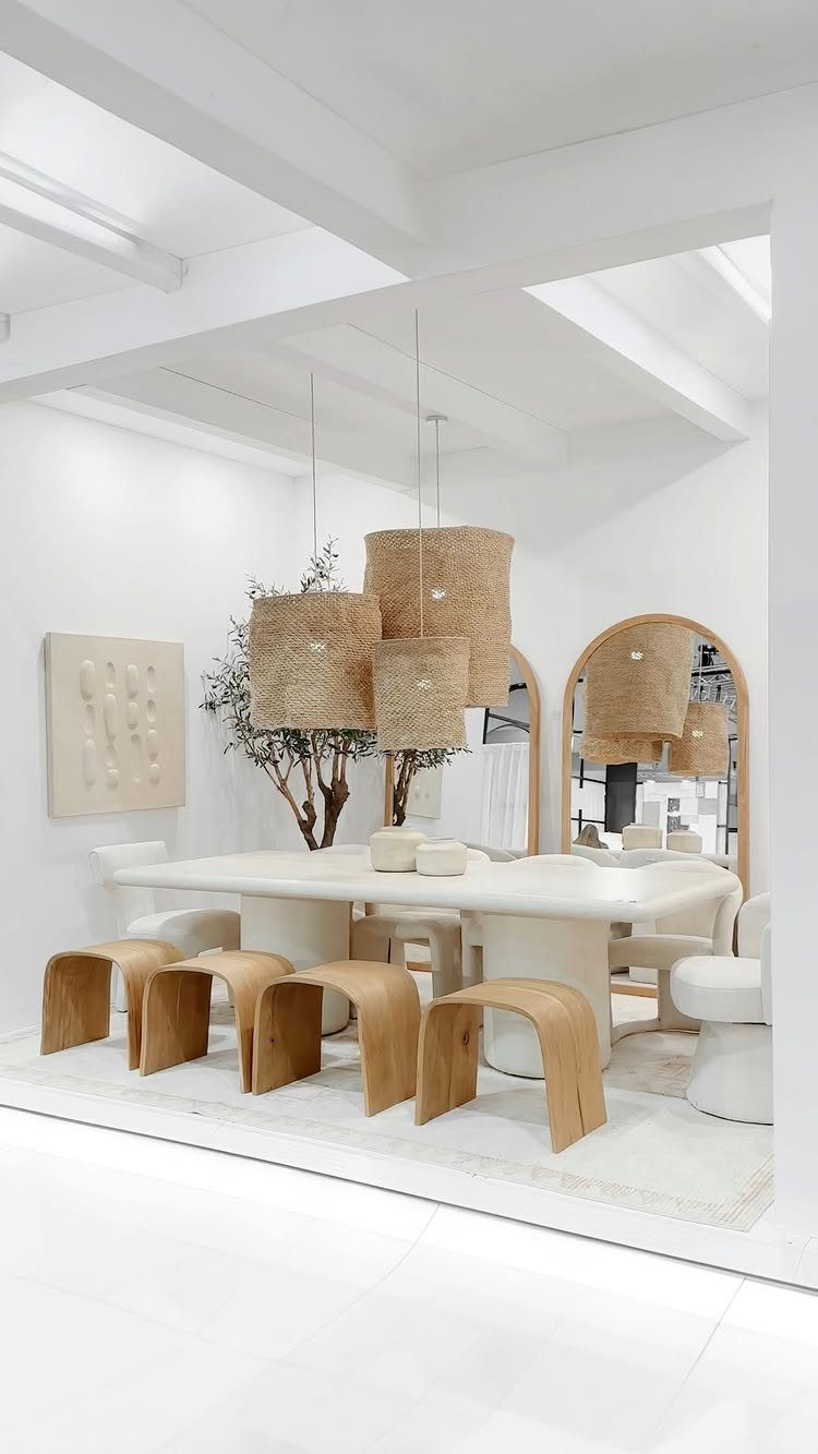 15 Dining Room Decor Modern Ideas with Style and Function 14 Modern dining room with white oval table, wooden benches, and woven pendant lights.