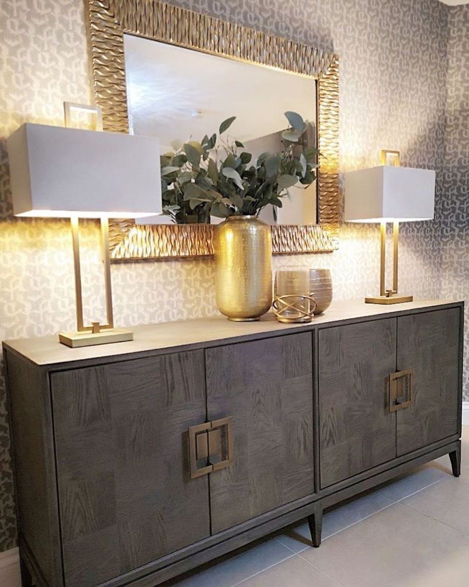 Dining Room Mid Century Ideas: 6 Ways to Style Your Space 2 Dark wood sideboard with gold accents, lamps, and a gold-framed mirror above.