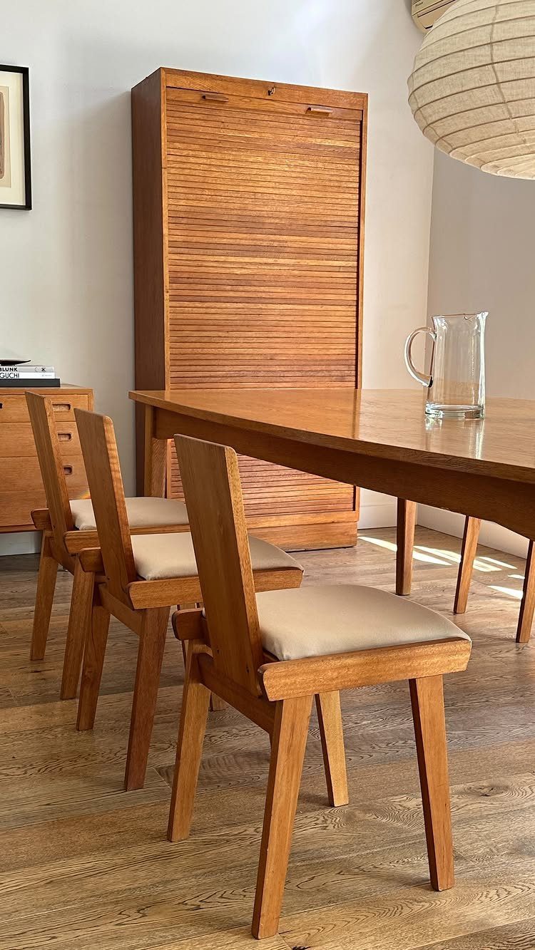 Dining Room Mid Century Ideas: 6 Ways to Style Your Space 1 Mid century modern dining set with wooden table, matching chairs, and tall cabinet.