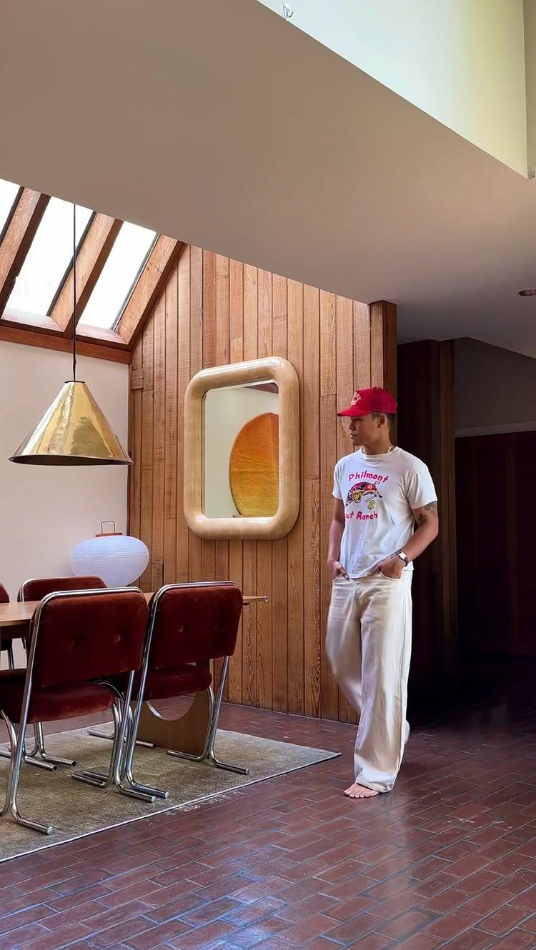 Dining Room Mid Century Ideas: 6 Ways to Style Your Space 3 Mid-century dining room with red leather chairs, wooden table, and wood-paneled walls.