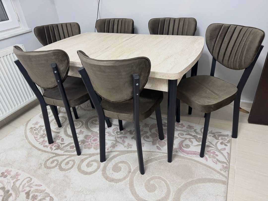 7 Dining Room Table Ideas for a Standout Space 7 Light wood rectangular dining table with olive green upholstered chairs on a patterned rug