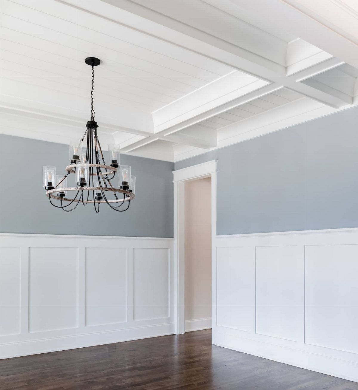 11 Dining Room Tray Ceiling Ideas with Photos 2 White shiplap coffered ceiling with a black chandelier in a blue dining room
