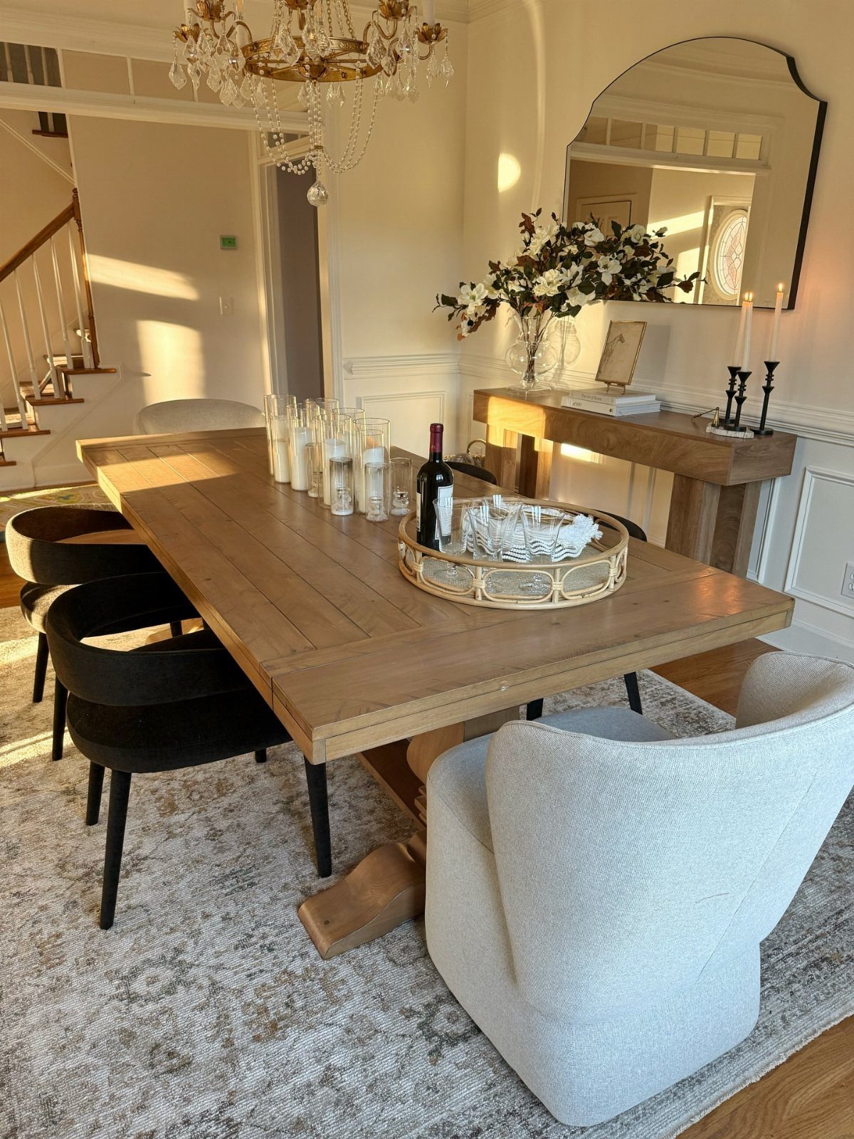 5 Dining Room with Carpet Ideas to Refresh Your Space 1 Wooden dining table and chairs anchored by a large grey patterned area rug.