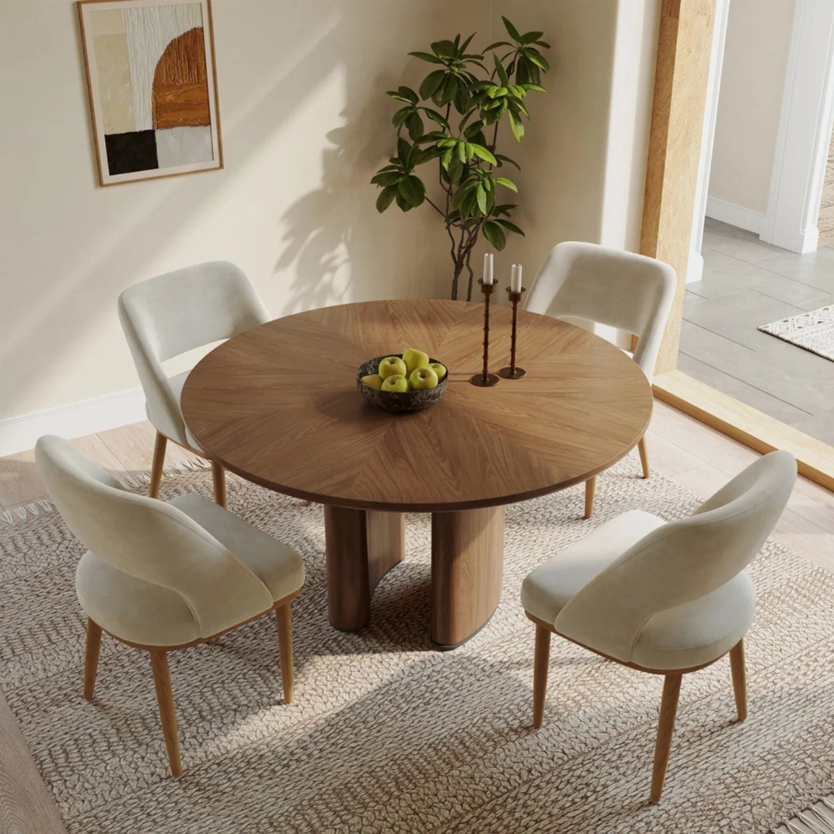 11 Dining Table Ideas for Small Spaces That Maximize Room 10 Round wooden pedestal dining table with four cream chairs on a beige rug.