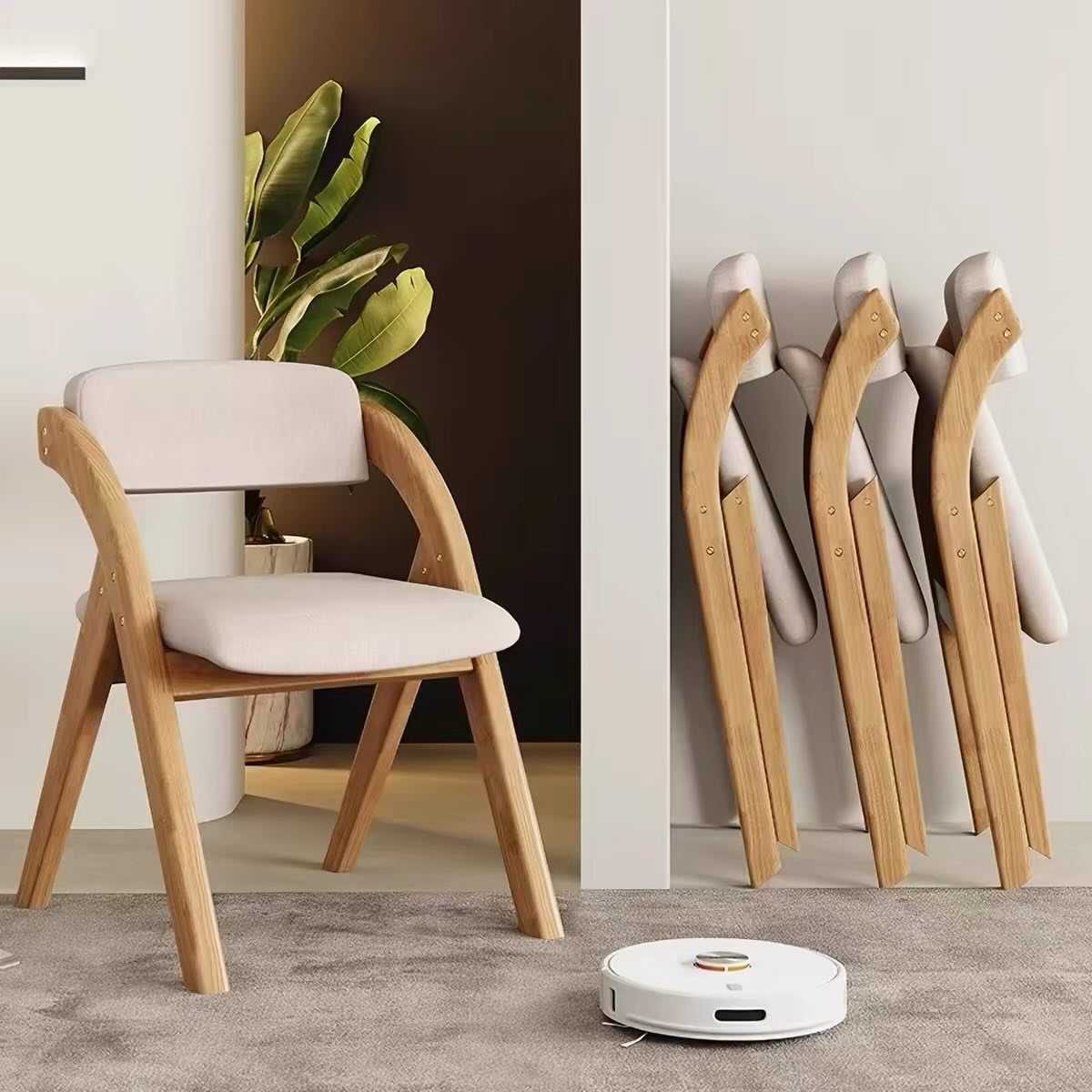 11 Dining Table Ideas for Small Spaces That Maximize Room 9 Light wood folding chairs with white cushions, one open and three folded against wall.