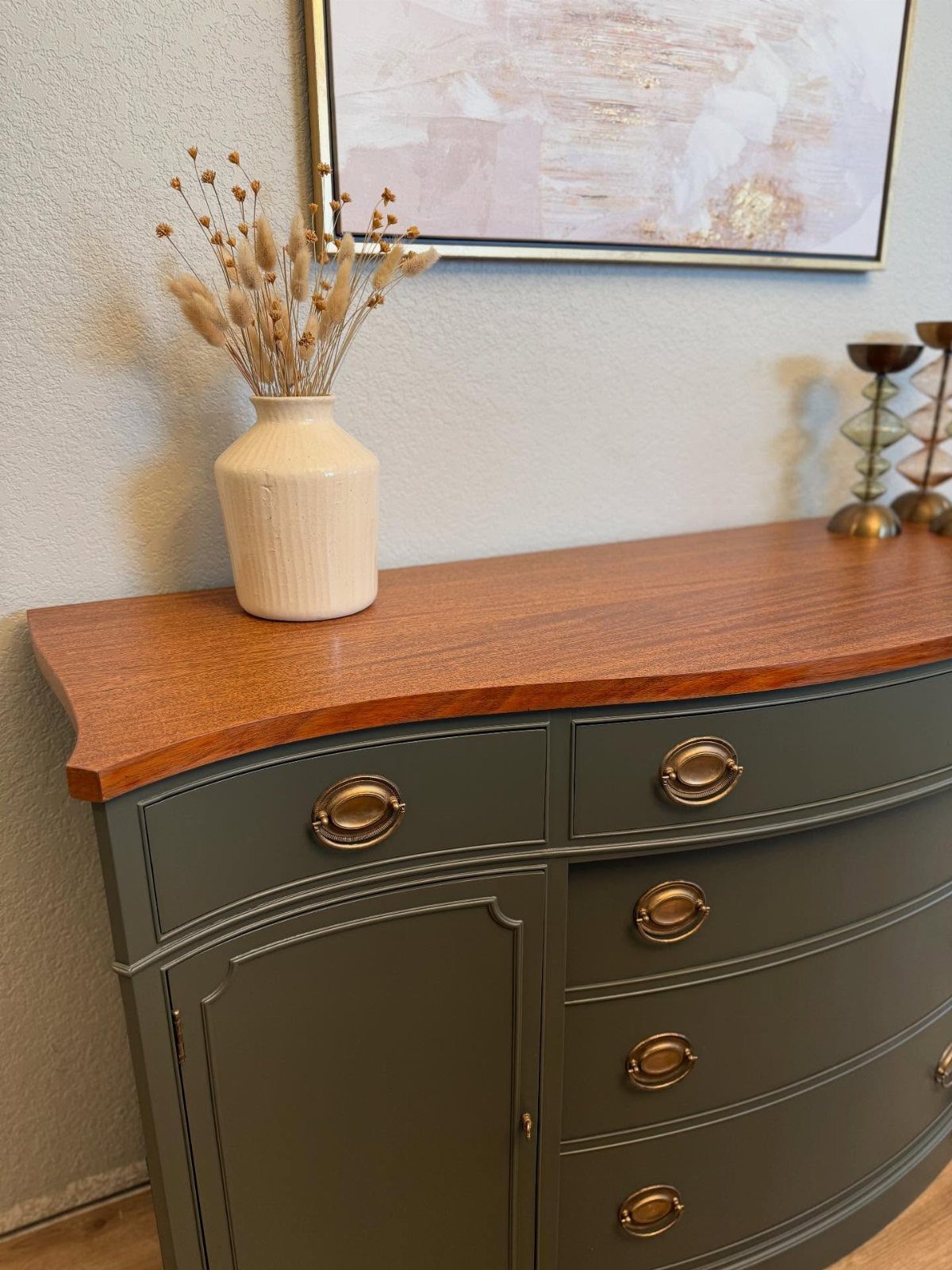 4 Evergreen Fog Dining Room Ideas with Photos 2 Green painted sideboard with wooden top and gold hardware against a light wall.