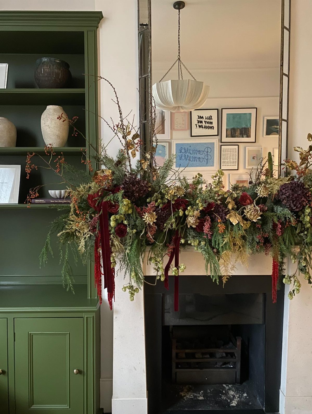 16 Fall Fireplace Mantel Decor Ideas with Photos 12 Fireplace mantel adorned with a dense arrangement of dried autumn flowers and greenery.