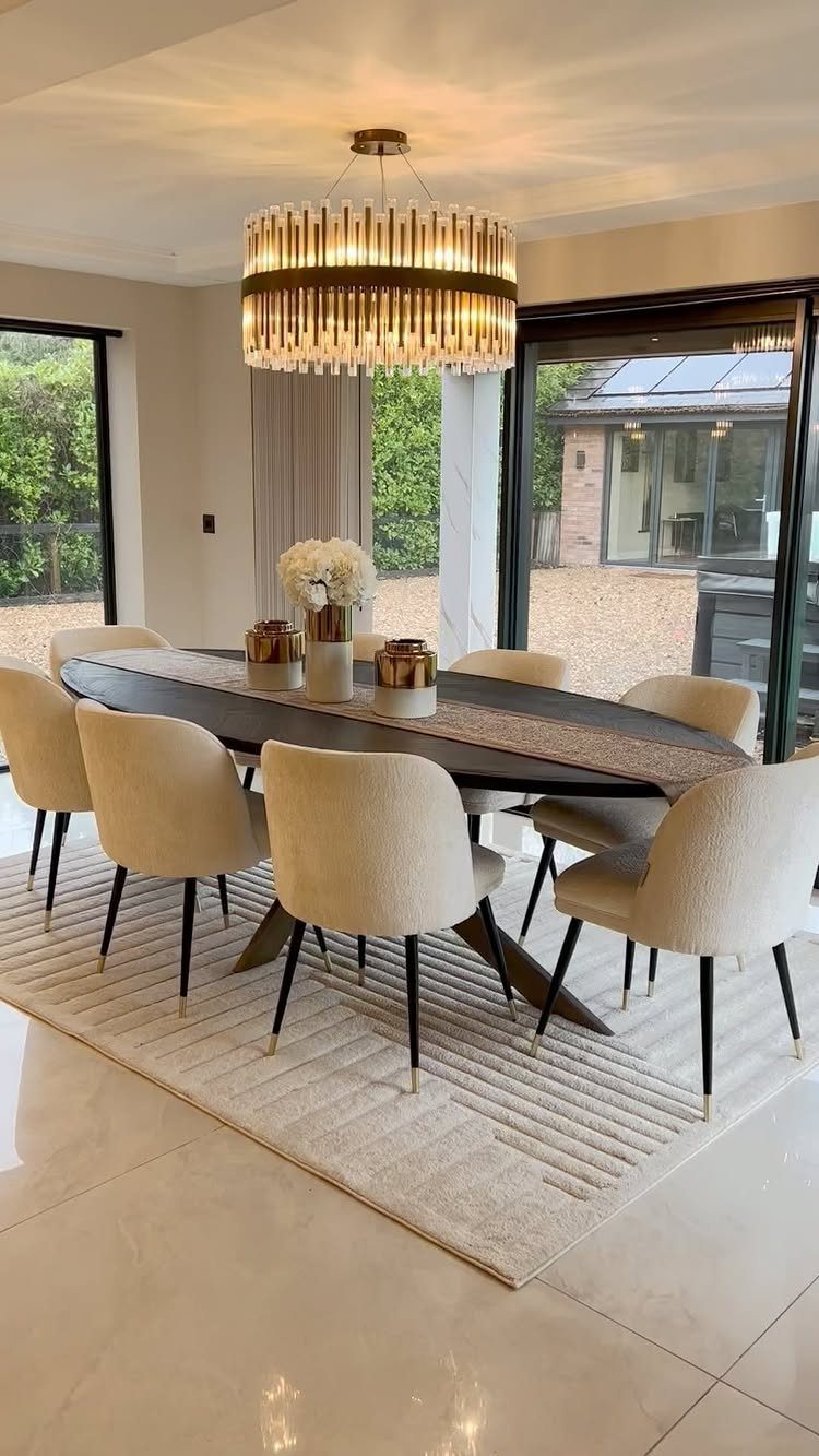 13 Formal Dining Room Ideas for an Elegant Space 9 Cream low-pile ribbed rug under a dark oval dining table with upholstered chairs.