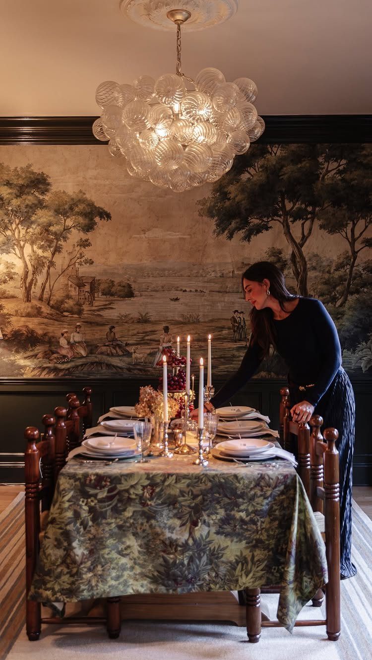 6 Formal Dining Table Decor Ideas for an Elegant Setting 2 Formal dining table with a patterned green tablecloth, white plates, and tall candles.