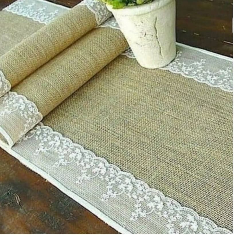 22 French Country Dining Room Ideas with Rustic Charm 20 Burlap table runner with white lace trim on a dark wood surface.