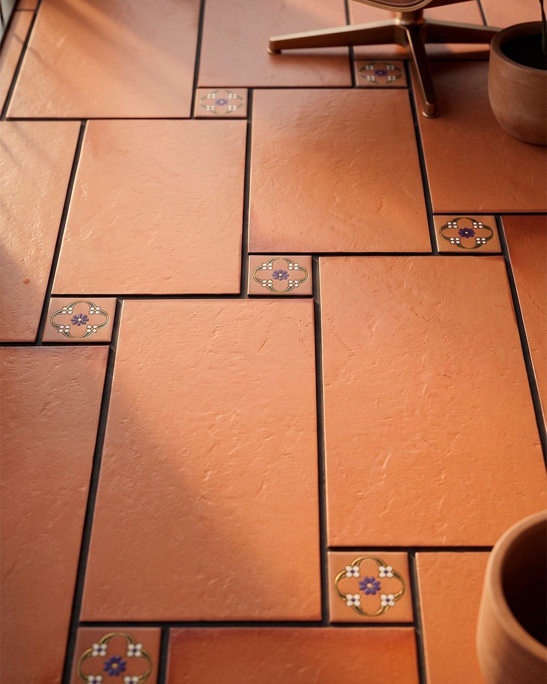22 French Country Dining Room Ideas with Rustic Charm 8 Terracotta floor tiles with small decorative floral accents in a warm-toned room.