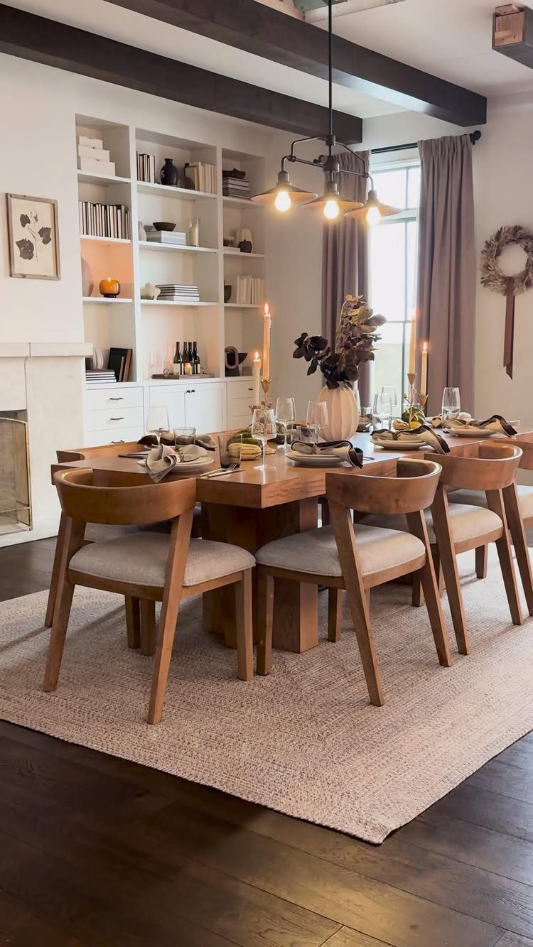 Wooden dining table with beige upholstered chairs on a neutral area rug.