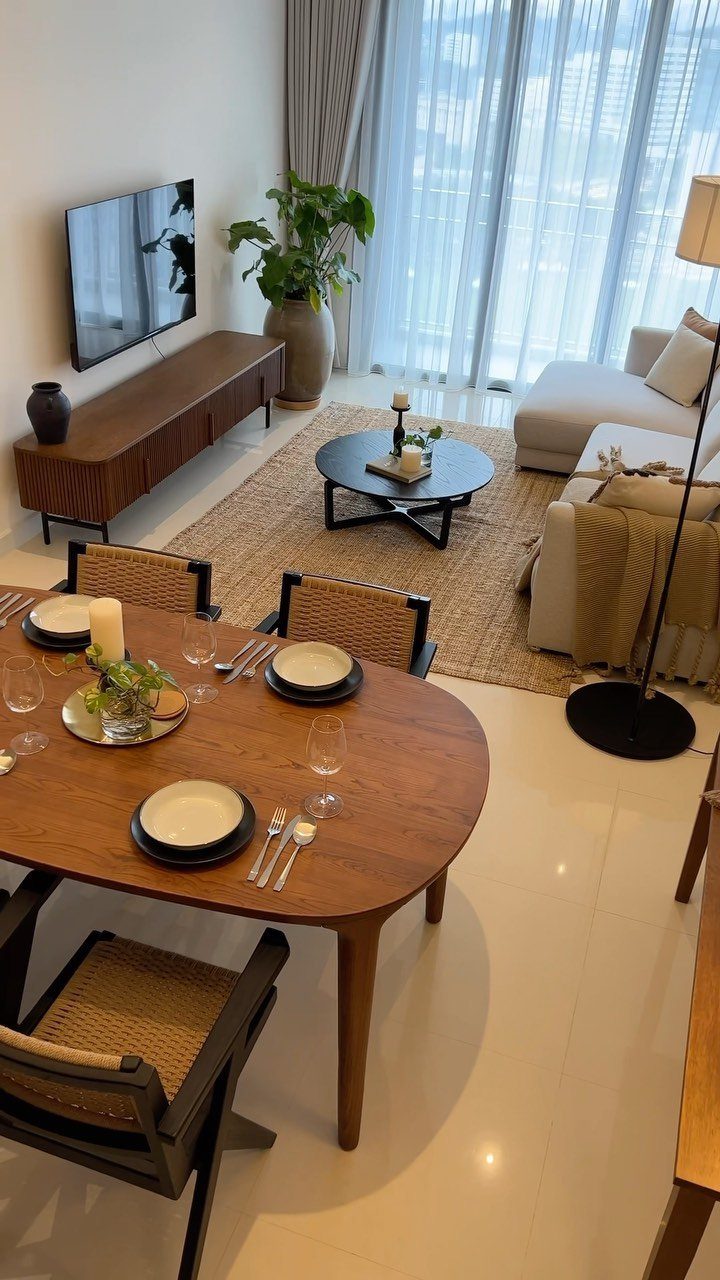 11 Living Dining Room Combo Ideas for Small Spaces 11 Wooden dining table and beige living room furniture in a bright open-concept space.