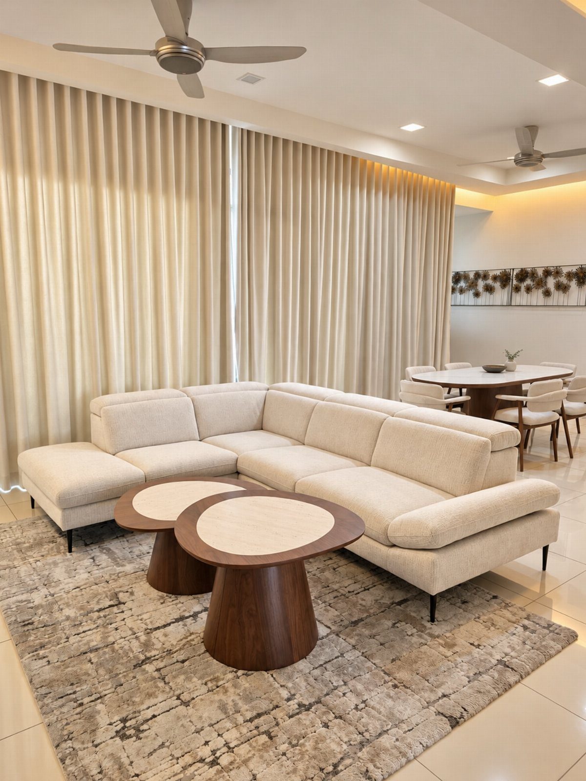11 Living Dining Room Combo Ideas for Small Spaces 7 Cream L-shaped sectional sofa with round wooden coffee tables in a bright living room.