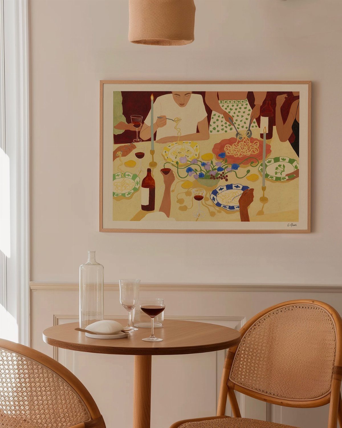 12 Living Dining Room Decor Ideas for Combined Spaces 5 Small wooden dining table and cane chairs with a framed painting on the wall
