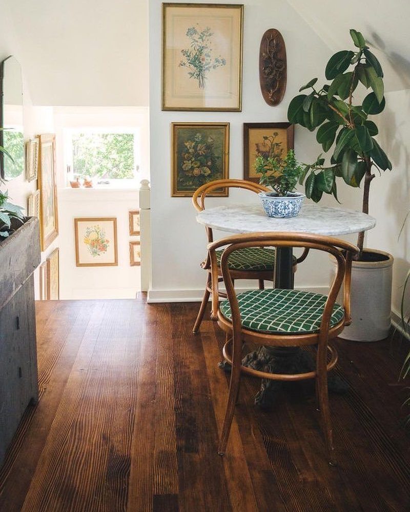 12 Living Dining Room Decor Ideas for Combined Spaces 8 Round marble bistro table with two wooden chairs in a sunlit dining area.