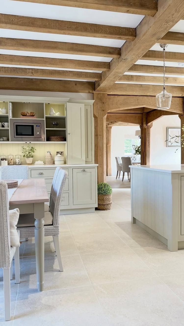 14 Modern Farmhouse Dining Room Ideas with Style 12 Wooden exposed beams on the ceiling of a bright modern farmhouse dining room