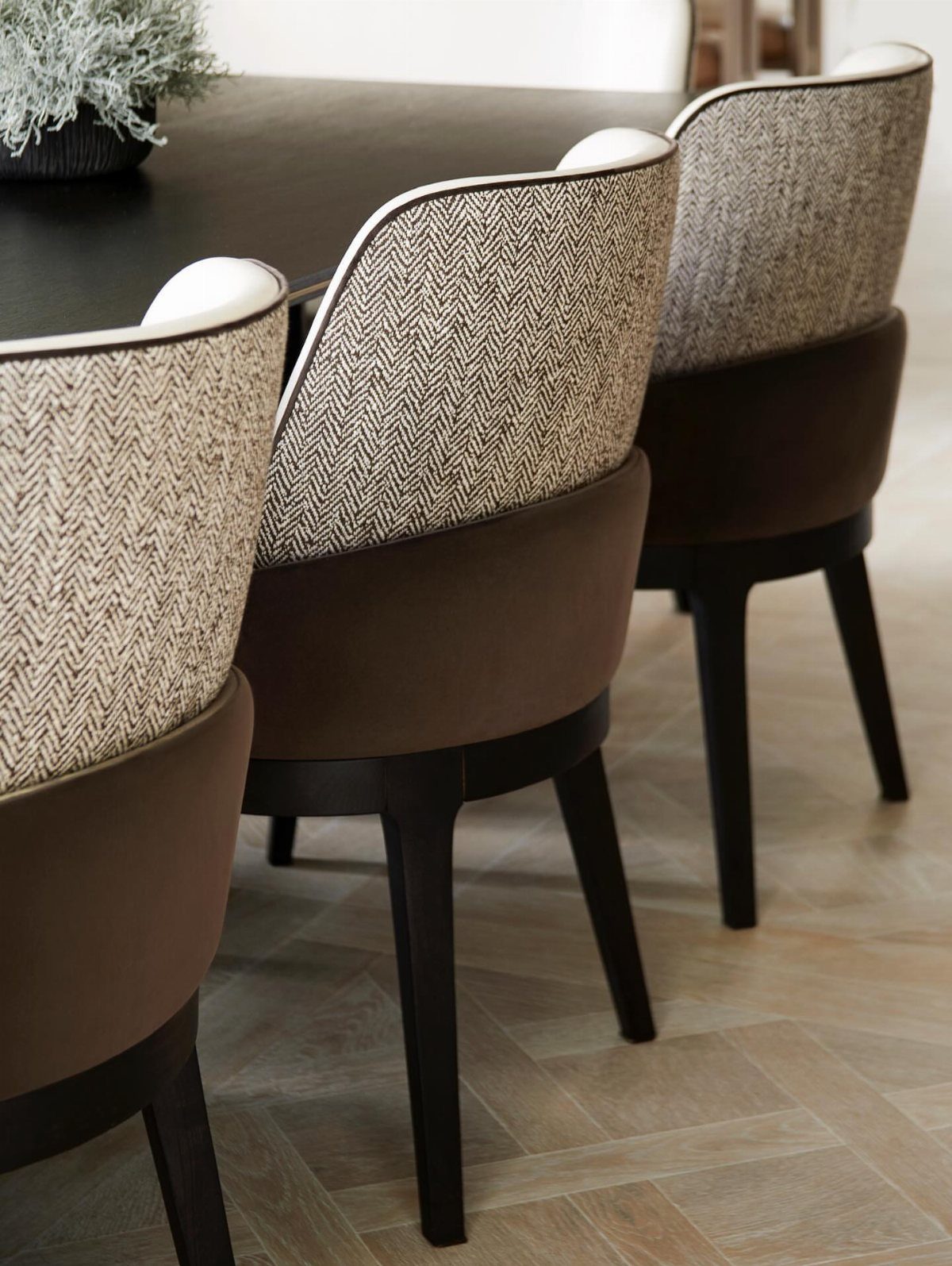 23 Modern Luxury Dining Room Ideas with Photos 12 Upholstered dining chairs with beige herringbone fabric and brown seats on wooden floors.