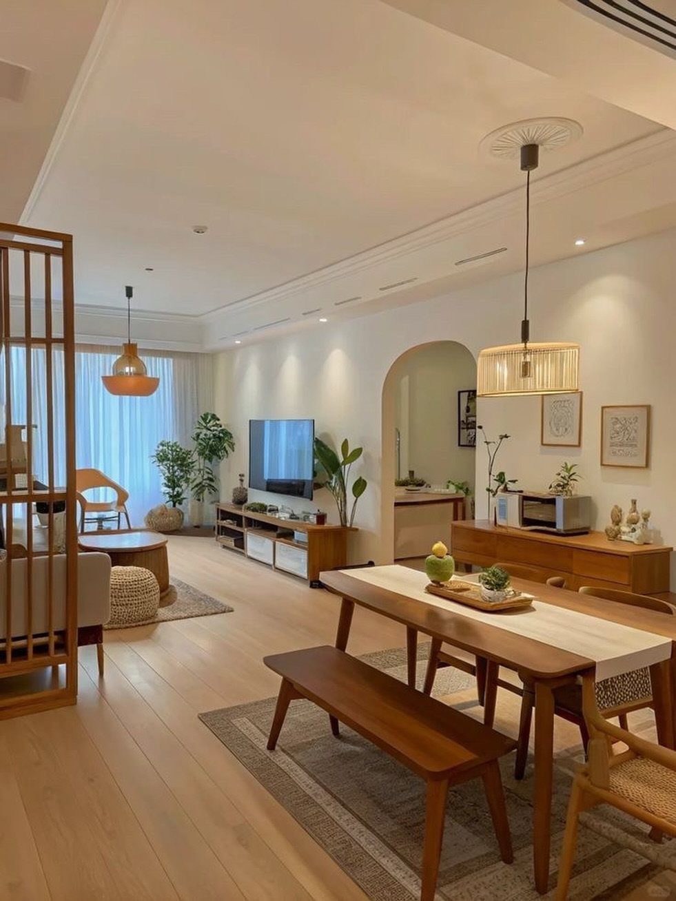 13 Open Concept Dining Room Ideas with Photos 9 Wooden dining table and bench in a bright open concept living room area