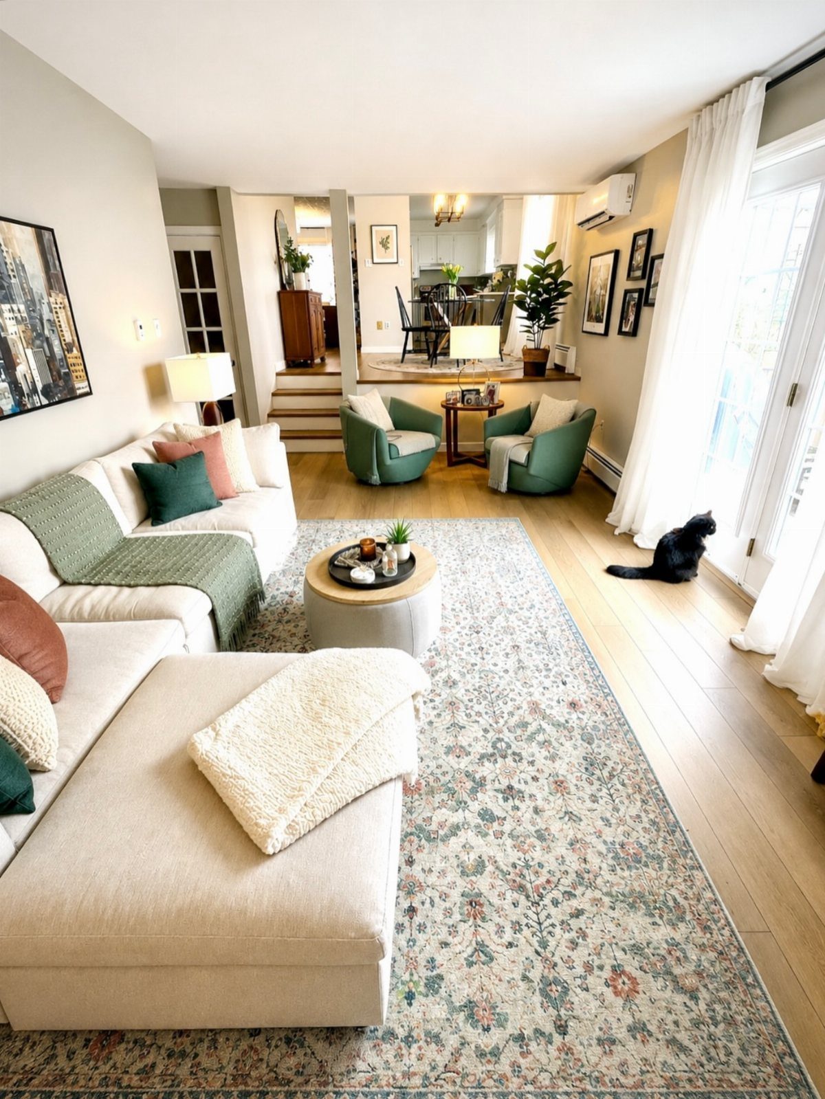 8 Ideas for an Open Living Room Dining Room Layout 2 Large patterned area rug defining a living room space with a white sectional sofa.