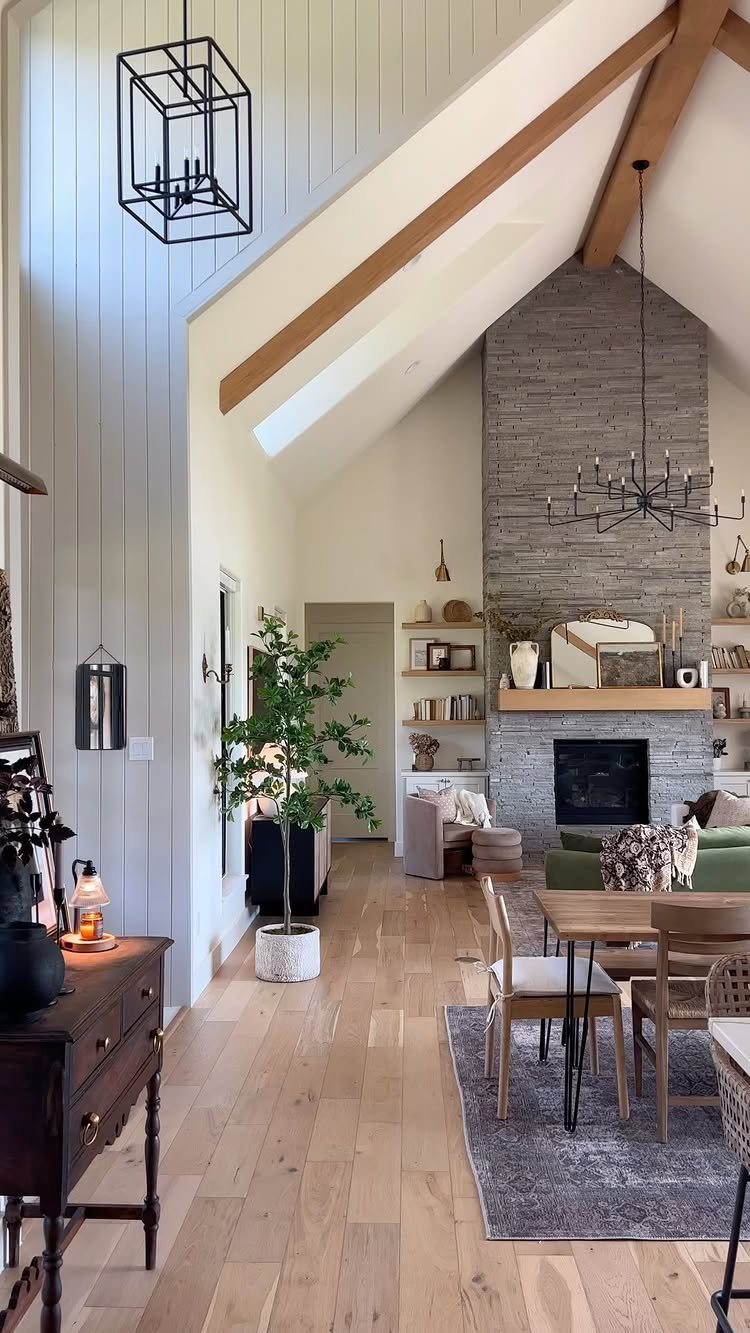 8 Ideas for an Open Living Room Dining Room Layout 1 Open concept living and dining room with white walls and light wood flooring.