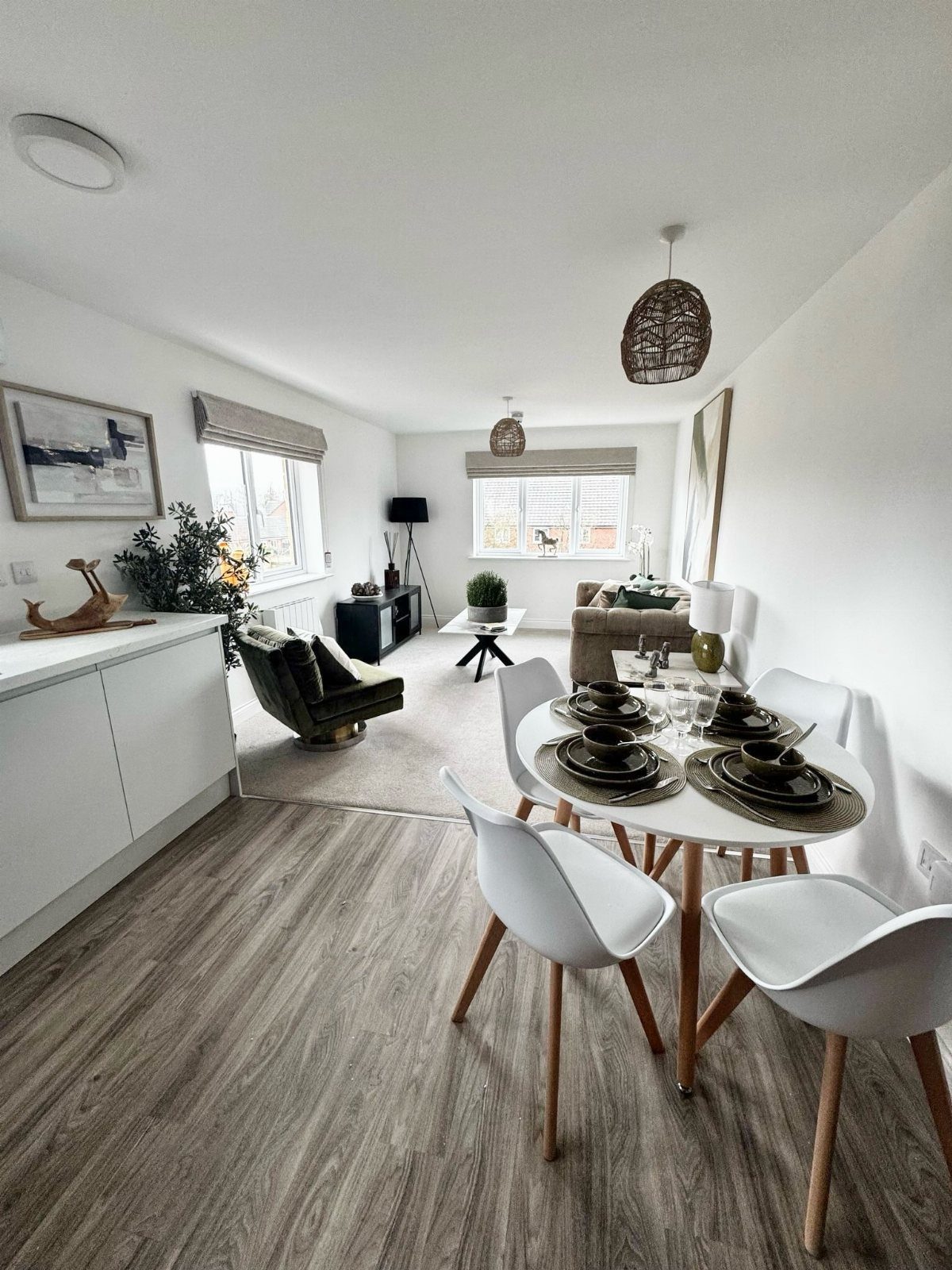 8 Ideas for an Open Living Room Dining Room Layout 6 Grey wood-look vinyl flooring in an open living and dining room area.