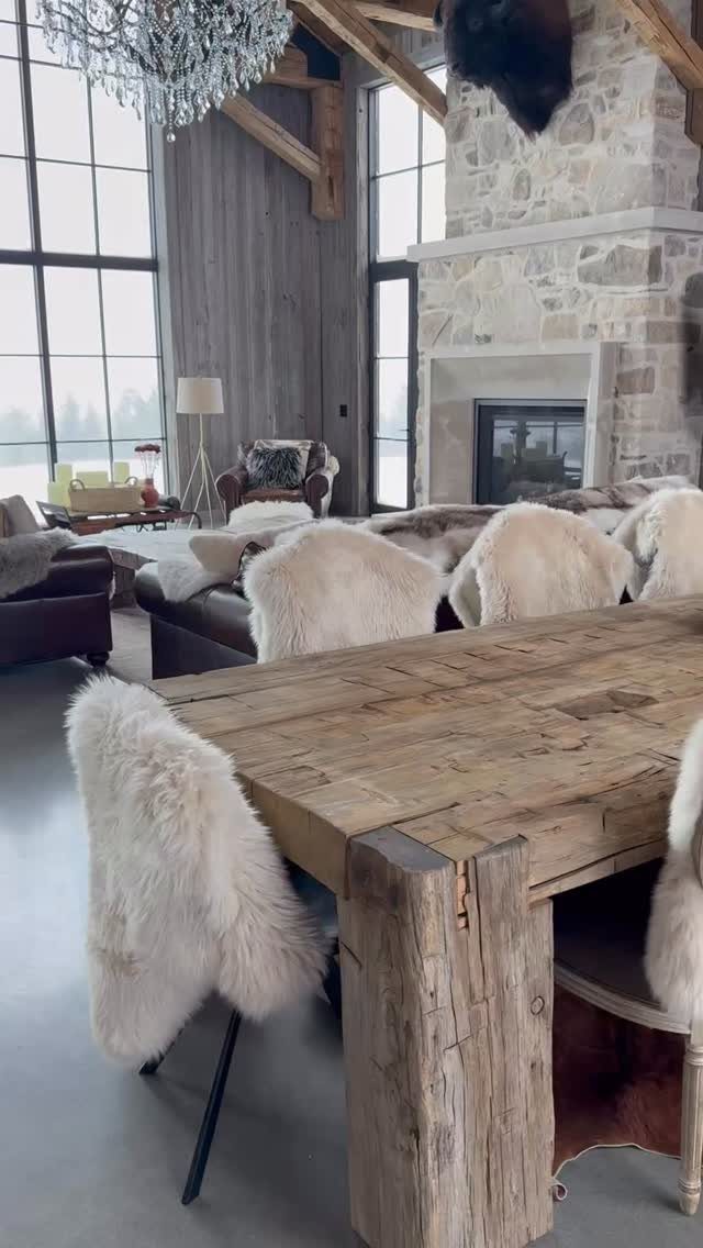 11 Rustic Modern Dining Room Ideas with Real Character 11 Rustic modern dining room with a heavy wood table and white fur chairs.