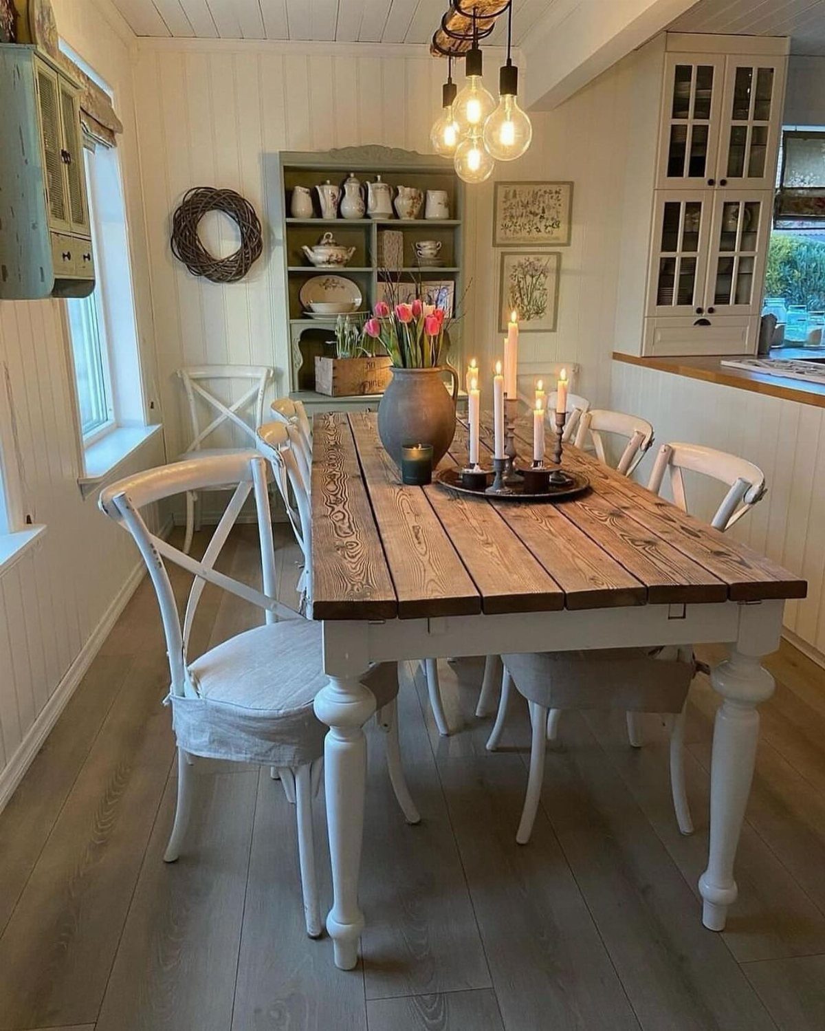 11 Rustic Modern Dining Room Ideas with Real Character 4 Wooden dining table with white chairs and a blue open shelving hutch background