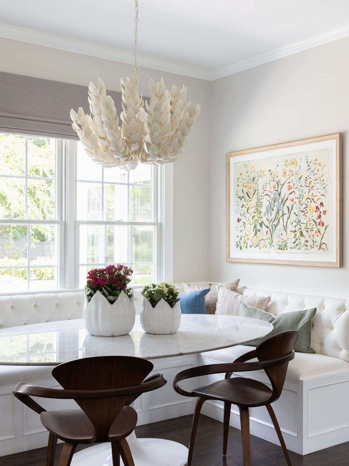 15 Small Breakfast Room Ideas for Cozy Spaces 15 White sculptural leaf chandelier hanging over a marble table in a bright breakfast nook.