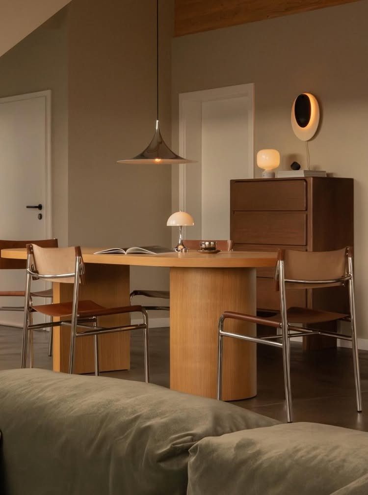 12 Small Dining Area Design Ideas That Maximize Space 11 Light wood dining table with tan leather chairs in a modern minimalist room.