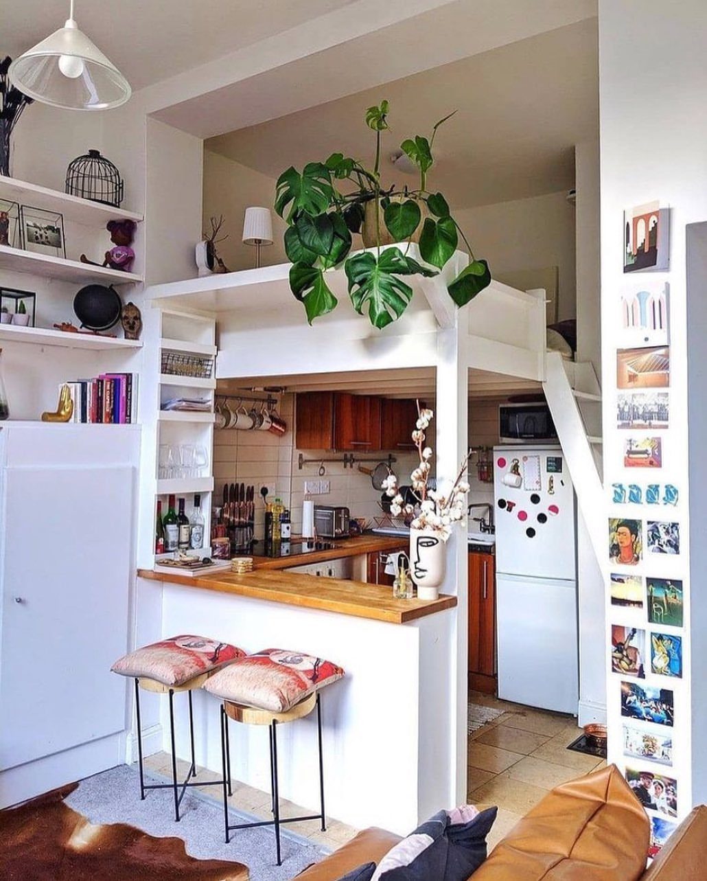 15 Small Living and Dining Room Ideas That Maximize Space 14 Loft bed over a small kitchen with a breakfast bar and stools.