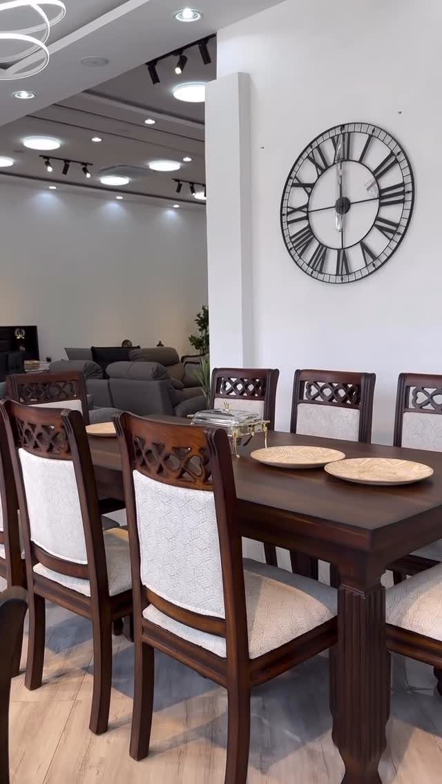 Traditional Modern Dining Room Ideas: 20 Ways to Blend Styles 2 Dark wood dining table with white upholstered chairs and a large wall clock.
