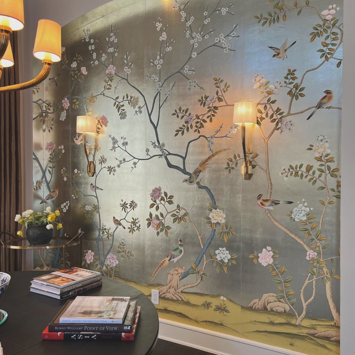 Silver Chinoiserie wallpaper with birds and blossoms in a traditional dining room setting.